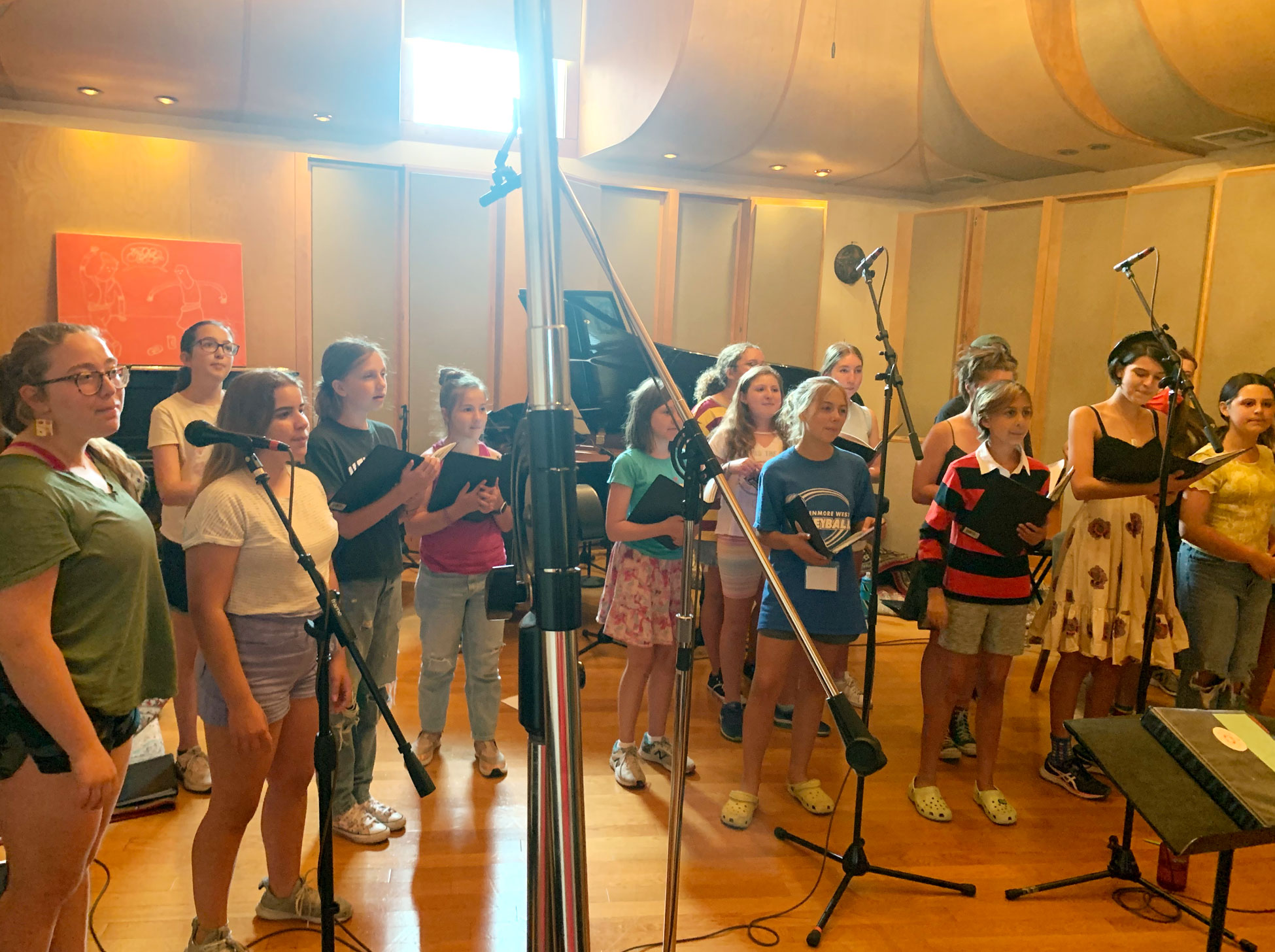 Group of young girls performing in recording studio